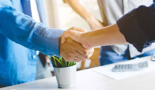 Two people shaking hands