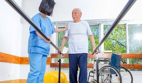 Elderly man receiving Physical therapy